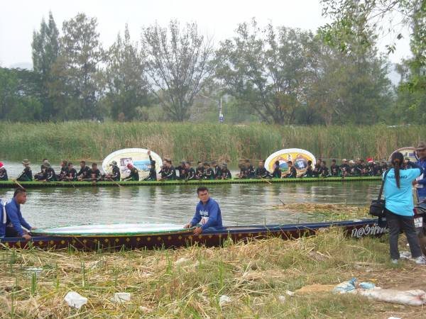 dragon boat with pictures<br />at shore of lake