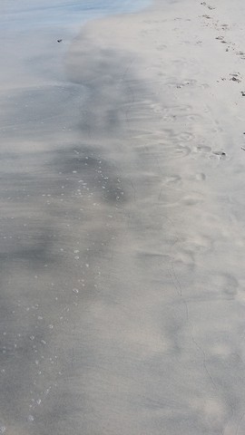Greyish tint in the sand
