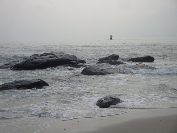 The rocks that give Hua Hin its name, mainly hidden by the tide