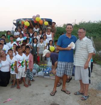 Rich gratefully receives the 100,000 baht raised through the generosity of this forum and friends to help these needy and well-deserving children: