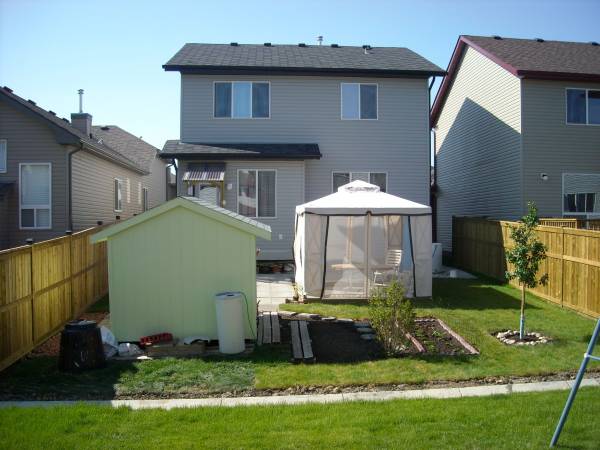 Back yard in Summer,<br />note not rear fence yet!