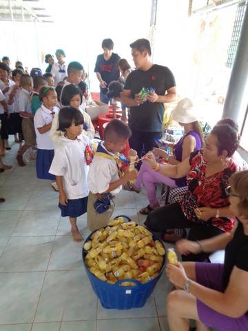 the older kids now queued up for treats.