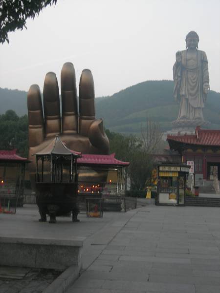 statue with hand in fore ground