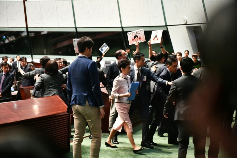 Chaotic scenes inside Hong Kong's legislature as the city's leader tried to deliver a policy address.